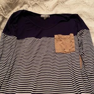 Cute detailing at pocket and sleeves!